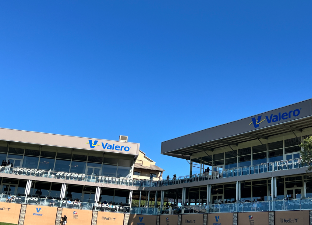 Large fan grandstand overlooking a green at the Valero Texas Open in San Antonio with spectators watching PGA Tour action