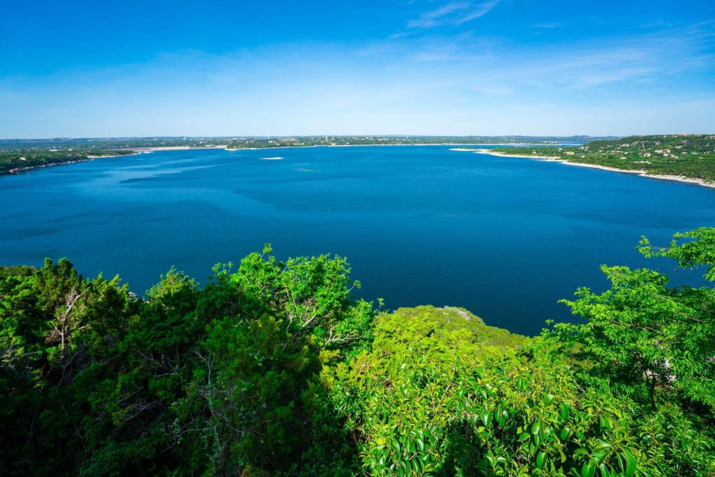 Canyon Lake summer vacation with blue skies and scenic lake views