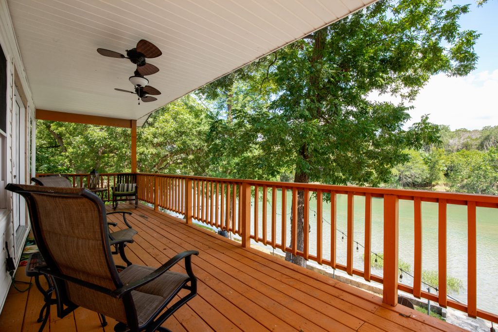 Private riverfront deck with rocking chairs overlooking the water, perfect for a romantic Valentine’s Weekend Getaway.